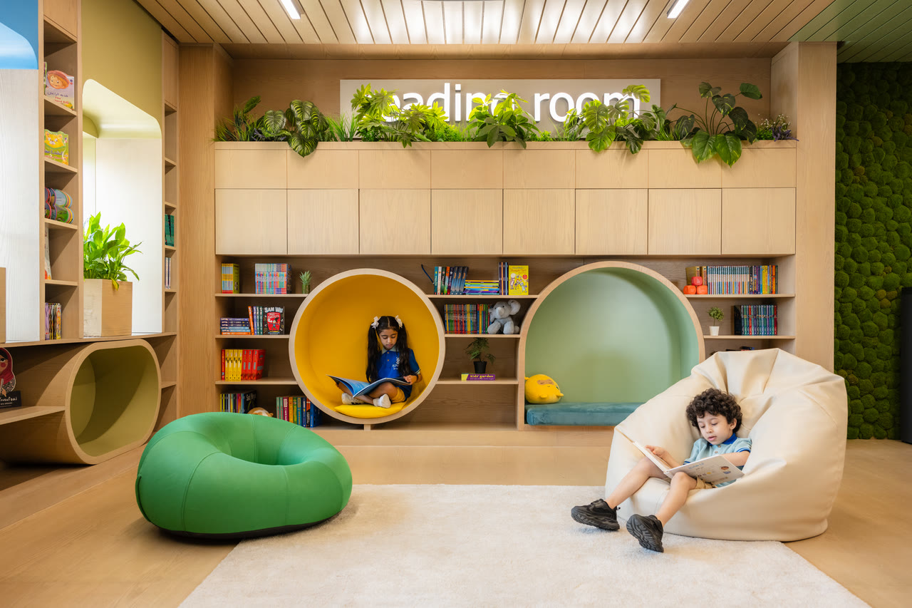 Two learners read in Alphera’s reading room.
